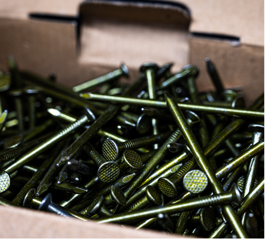 Close up image of a box of nails, one of the many worksite supplies offered by Six Side Supply.